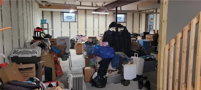 a room with gym equipment and a mirror