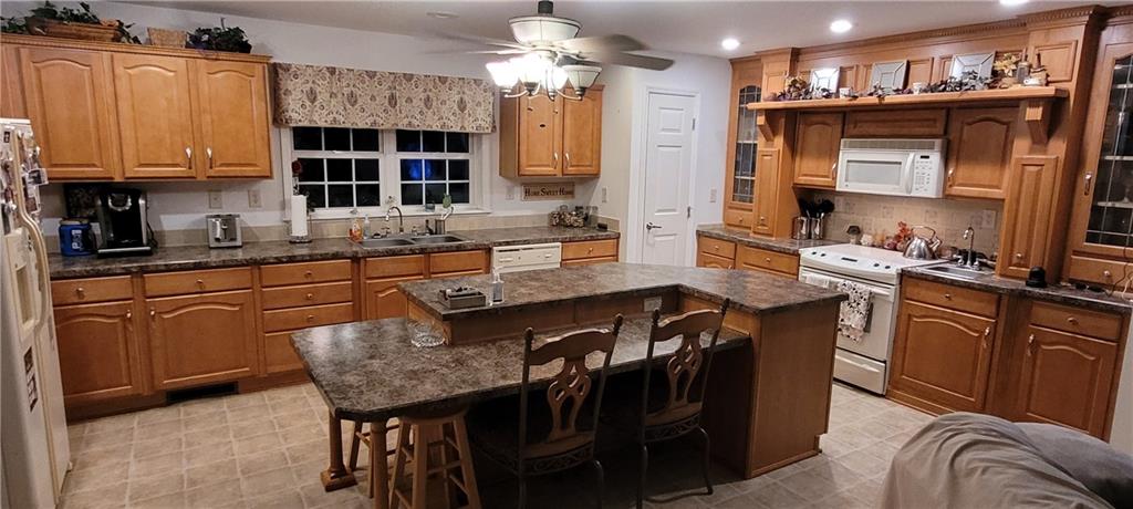 190 Linnwood Road Eighty Four, PA 15330 - Photo 5 of 30 a kitchen with granite countertop a sink appliances and cabinets