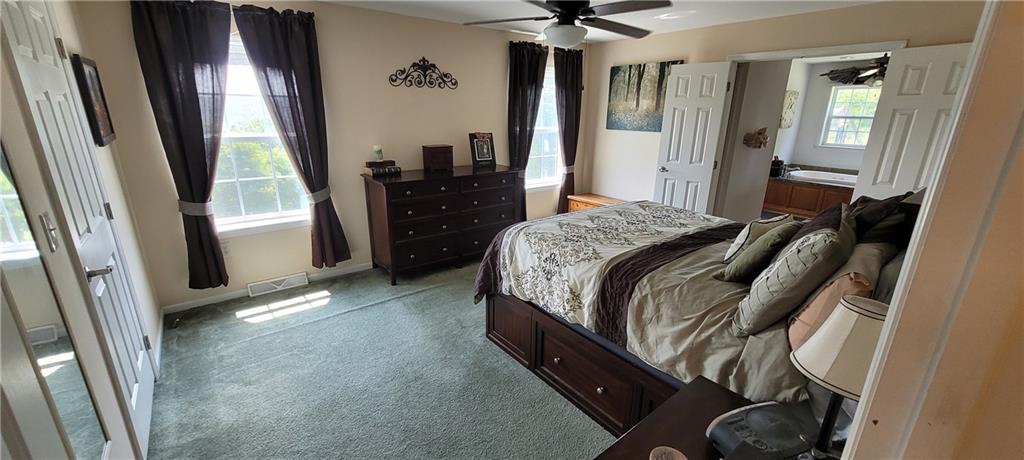 190 Linnwood Road Eighty Four, PA 15330 - Photo 10 of 30 a bedroom with a bed and a mirror