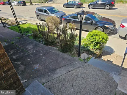 a view of a backyard with sitting area