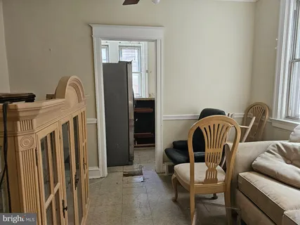 a living room with hard wood floors and a window