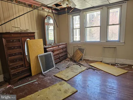 a view of front door and wooden floor