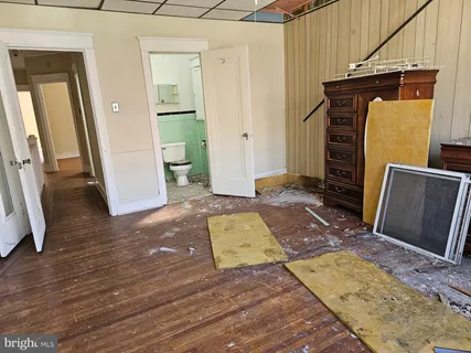 a bathroom with a toilet sink and shower