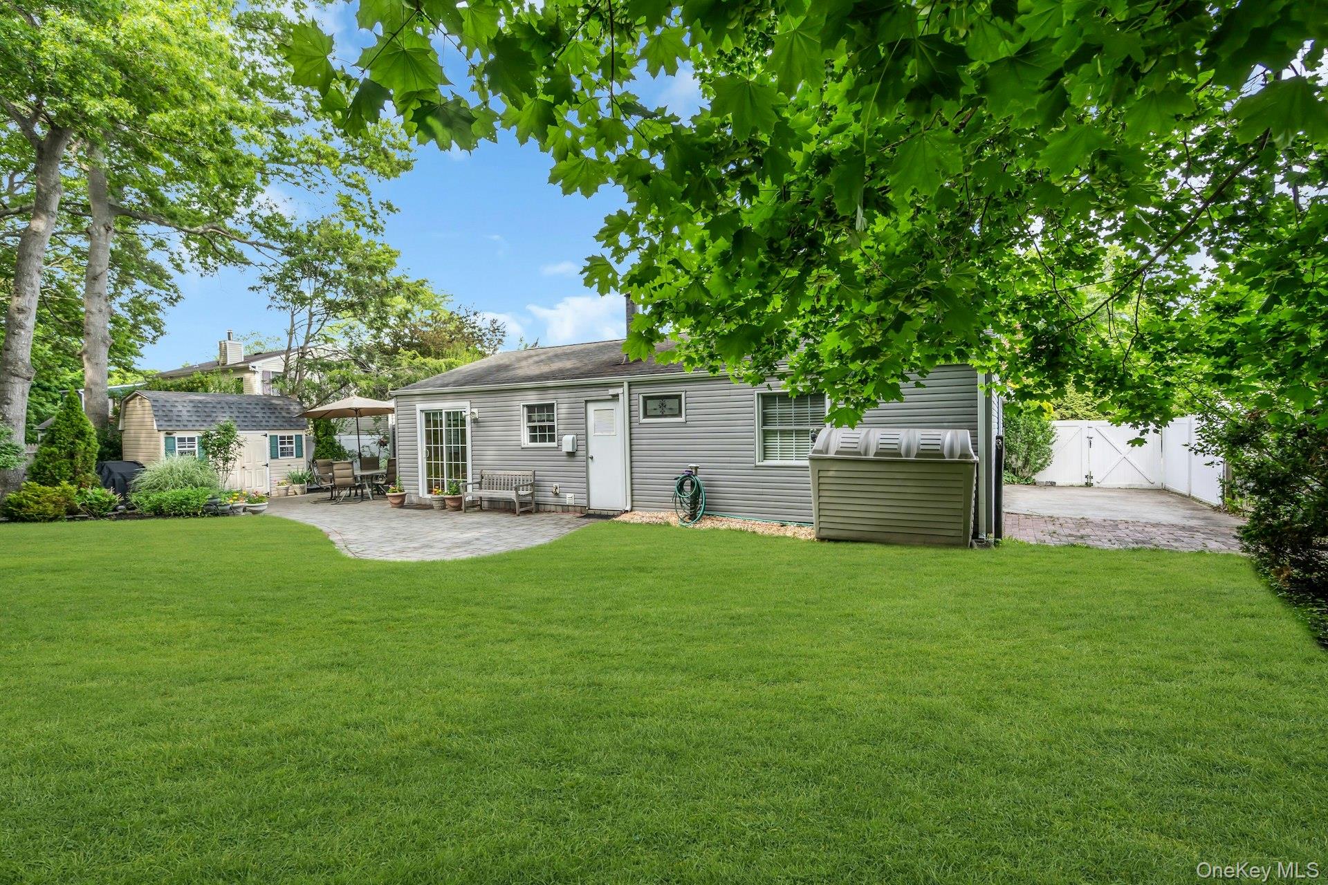 71 Ridge Haven Drive Ridge, NY 11961 - Photo 23 of 23 Backyard With Second Shed and Concrete Storage Area for Boat or RV