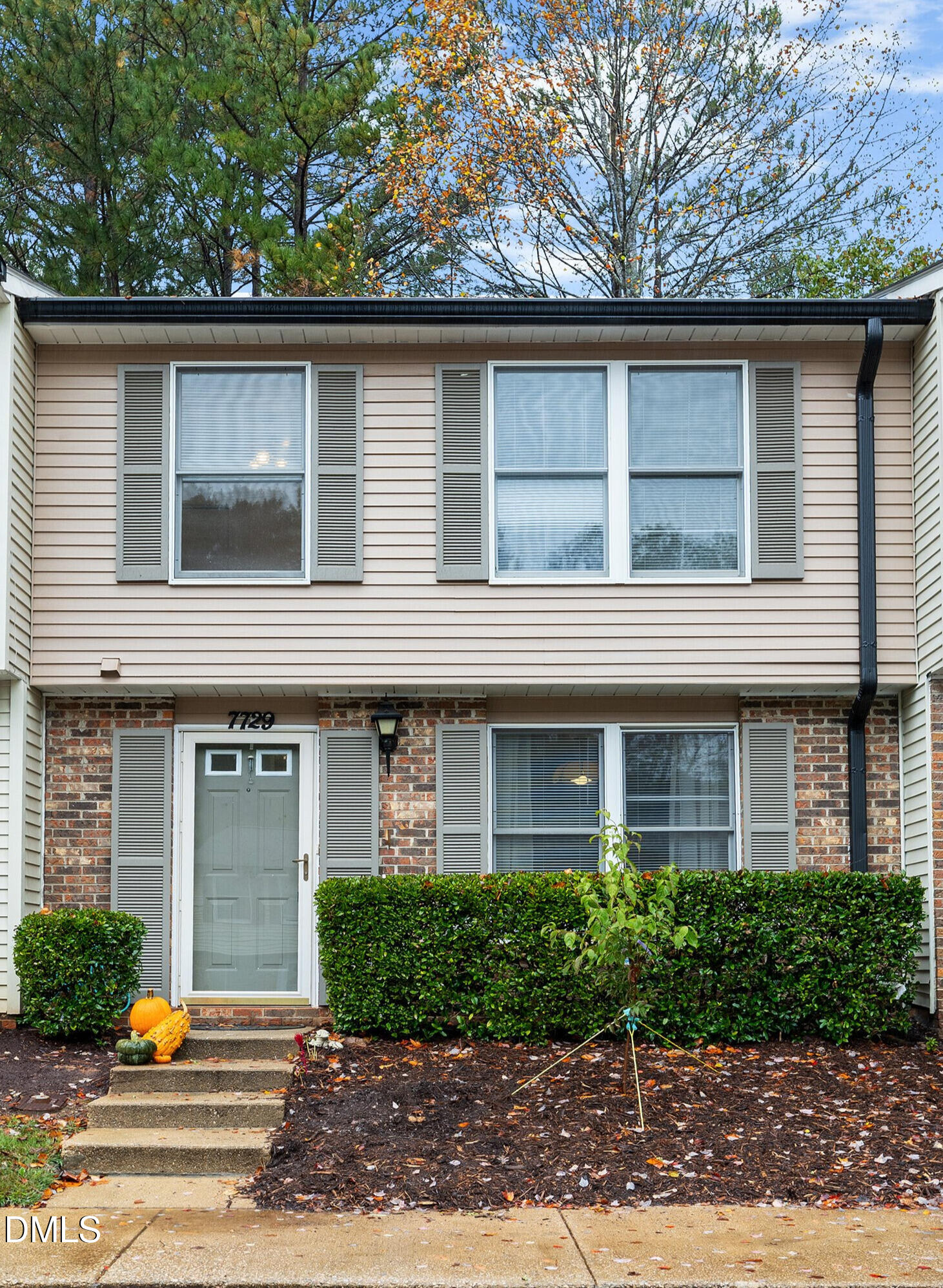 7729 Bernadette Lane Raleigh, NC 27615 - Photo 30 of 34 a front view of a house with garden