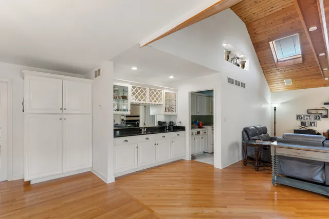 a kitchen with stainless steel appliances a refrigerator and a stove top oven