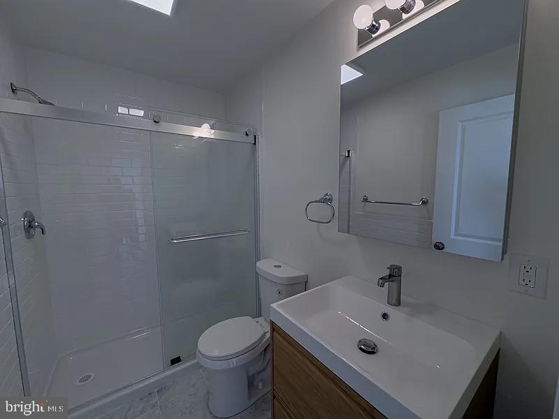 2005 Green Street, Unit 2F Philadelphia, PA 19130 - Photo 3 of 11 a bathroom with a sink toilet and shower