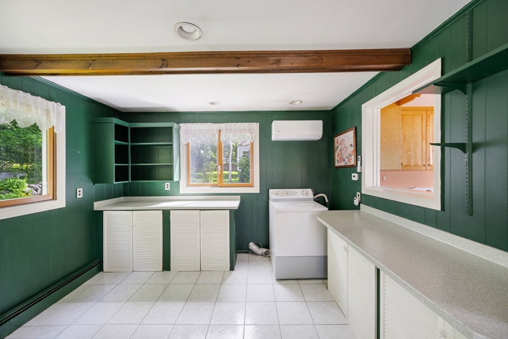 40 Bell Road Weymouth, MA 02188 - Photo 27 of 41 a kitchen with a sink and a refrigerator