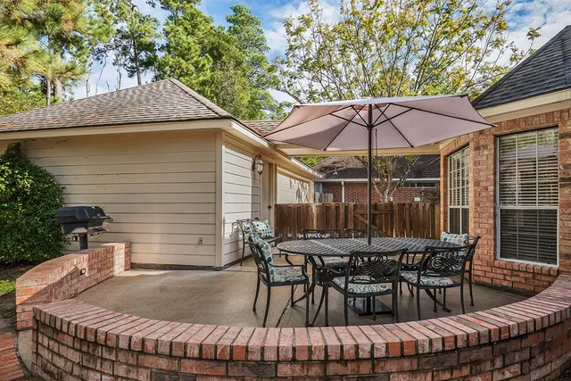 a view of backyard of house with seating space
