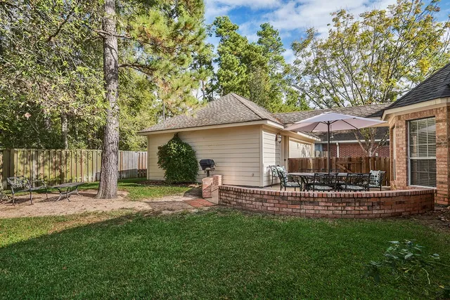 a view of a house with a yard porch and sitting area