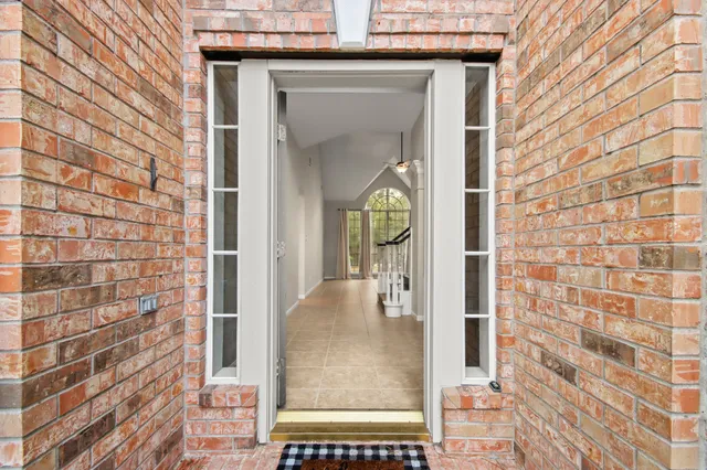 a view of a door and a window