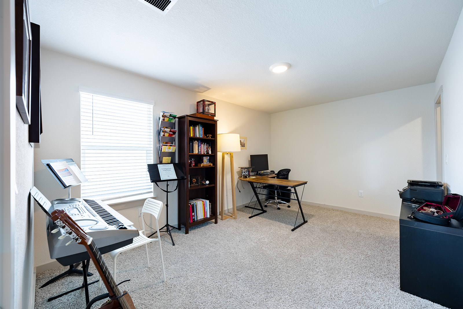 900 Balsora Cove Georgetown, TX 78628 - Photo 23 of 39 An adaptable secondary room with soft carpeting and natural light, perfect for a home office or creative studio.