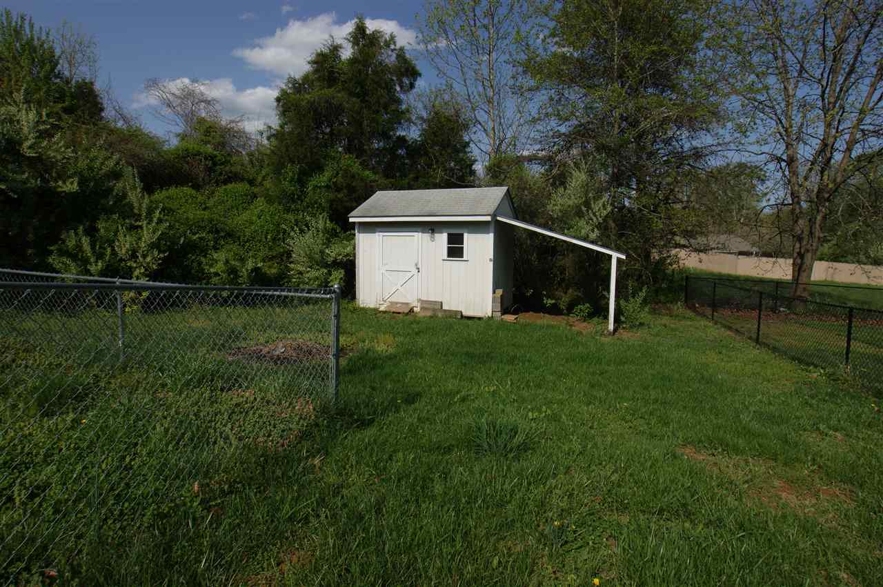 136 Narcissus Road Ruckersville, VA 22968 - Photo 15 of 15 a backyard of a house with plants and large trees