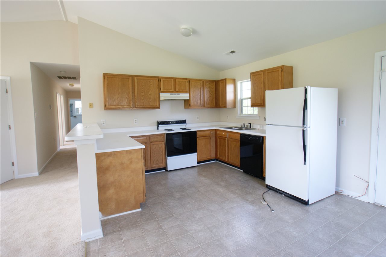 136 Narcissus Road Ruckersville, VA 22968 - Photo 3 of 15 a kitchen with stainless steel appliances a sink a stove a refrigerator a center island and a cabinets