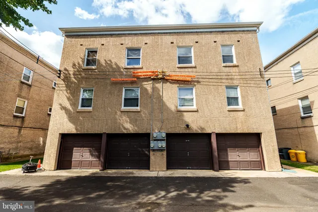 a front view of a house with parking