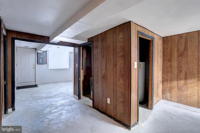 an empty room with closet and a bathroom