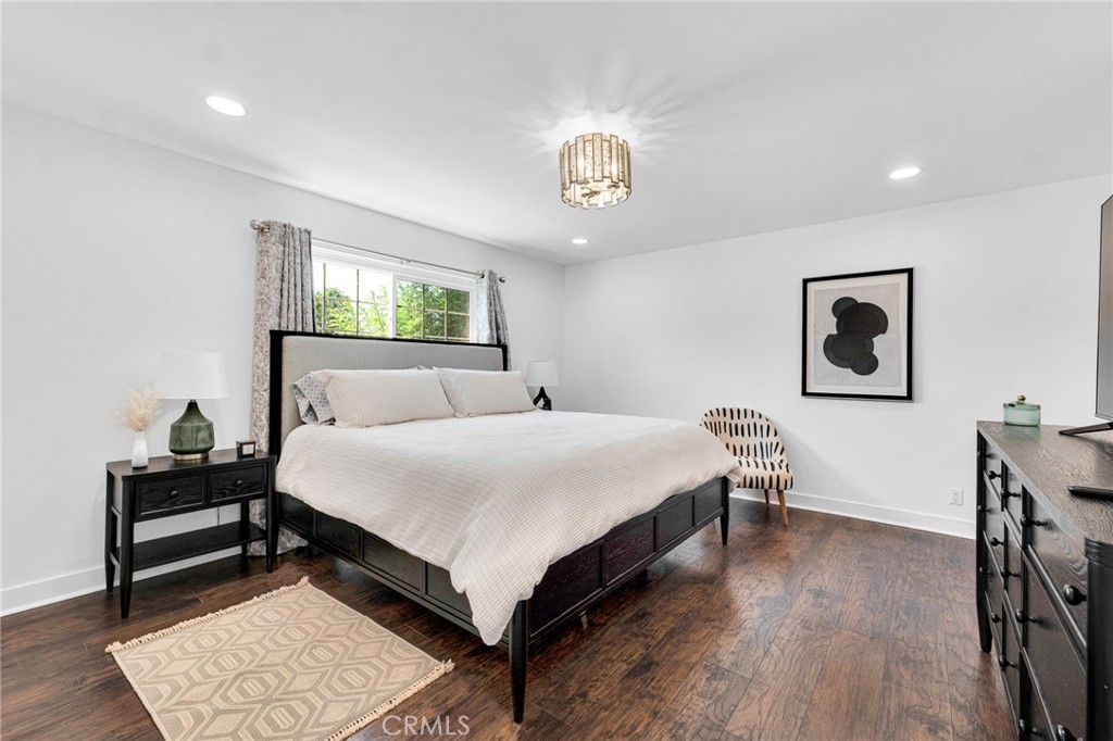 109 Triangle Street Thousand Oaks, CA 91360 - Photo 15 of 32 a bedroom with a bed and wooden floor