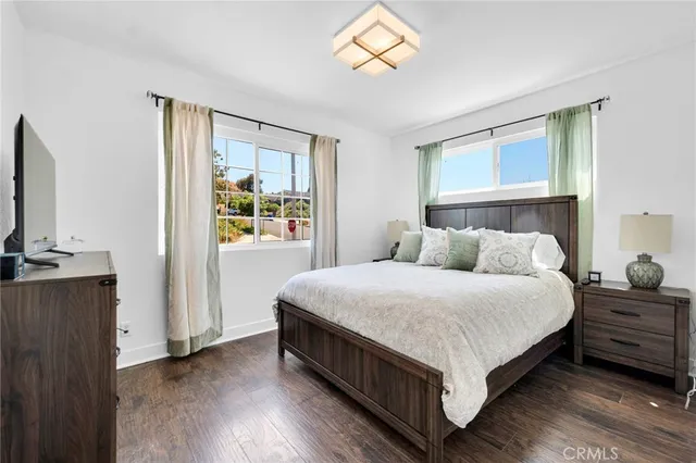 a bed room with a bed and a tv