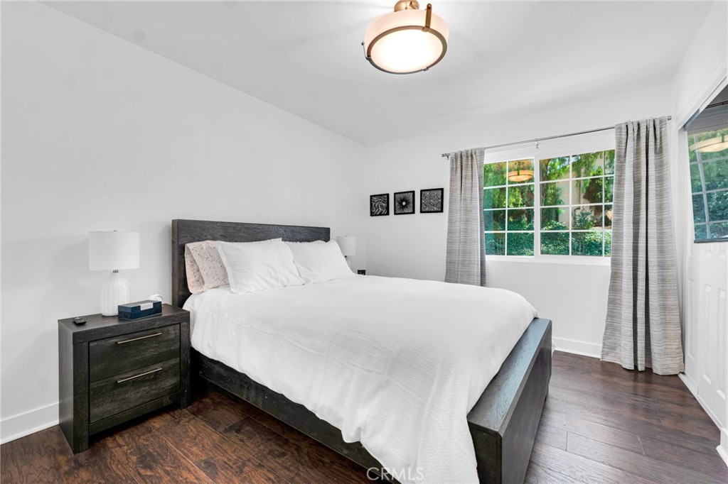 109 Triangle Street Thousand Oaks, CA 91360 - Photo 22 of 32 a bedroom with a bed and wooden floor