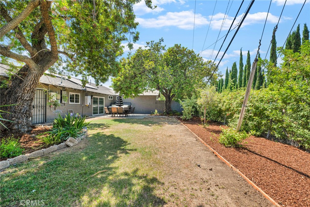 109 Triangle Street Thousand Oaks, CA 91360 - Photo 30 of 32 a front view of a house with a yard and a garden