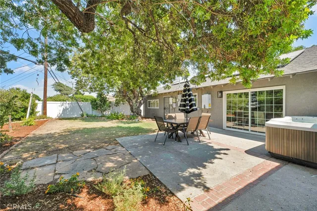 a view of a backyard with sitting area
