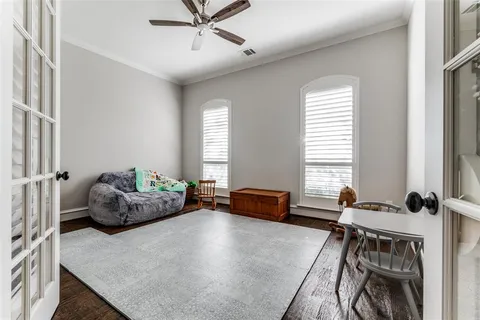 a bedroom with furniture and windows