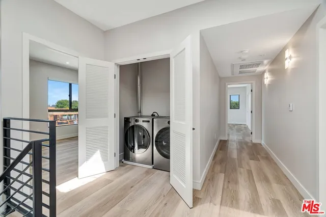 a view of a hallway with a livingroom