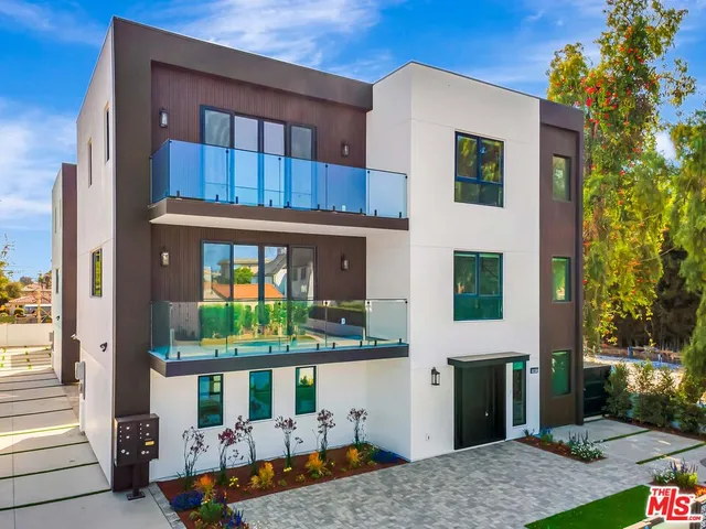 a backyard of a house with yard fire pit and outdoor seating