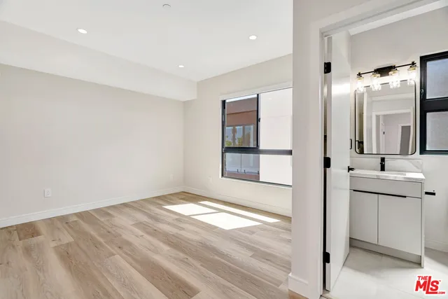 a view of a bathroom with sink and mirror