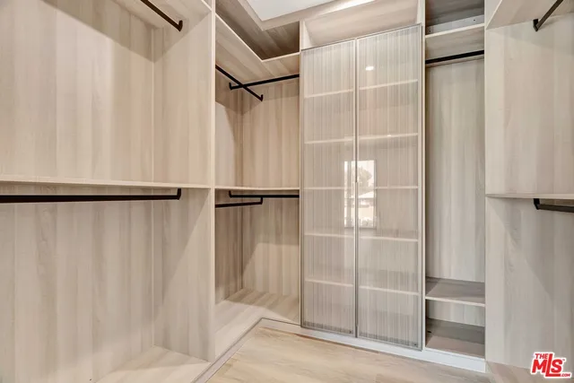 a bathroom with a glass shower door