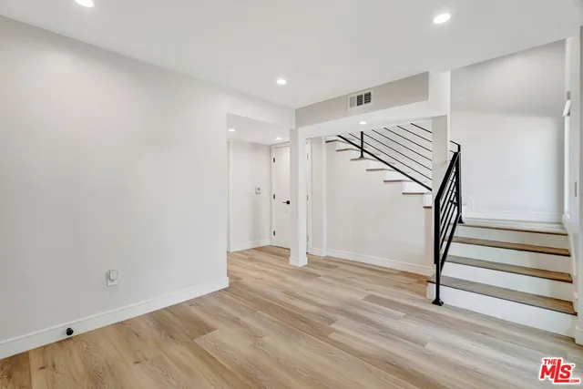 a view of entryway with wooden floor