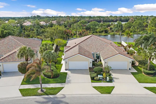 a view of a backyard with swimming pool and porch