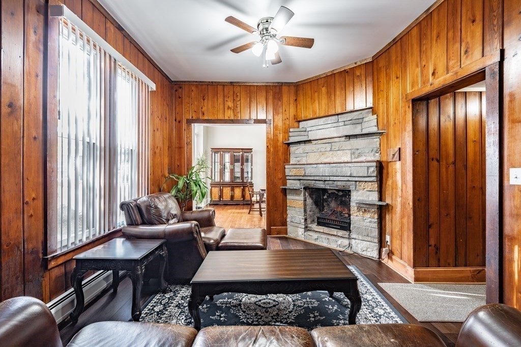 175 Mill Street Springfield, MA 01108 - Photo 11 of 42 a living room with furniture and a fireplace