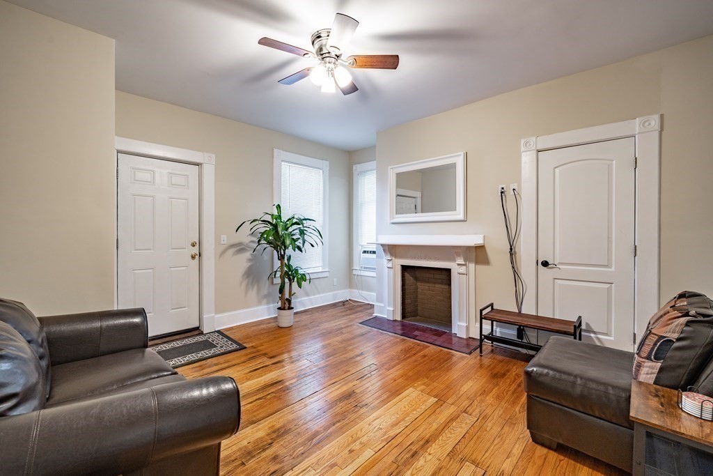 175 Mill Street Springfield, MA 01108 - Photo 21 of 42 a living room with furniture and a fireplace