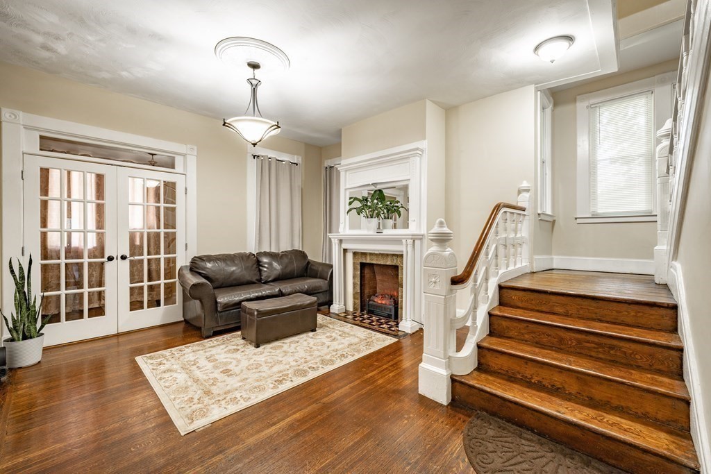 175 Mill Street Springfield, MA 01108 - Photo 3 of 42 a living room with furniture and a fireplace
