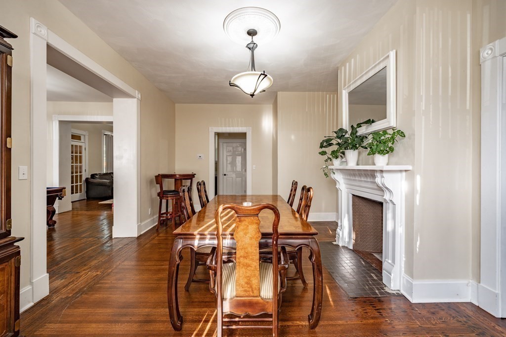 175 Mill Street Springfield, MA 01108 - Photo 7 of 42 a view of a dining room with furniture wooden floor and a chandelier