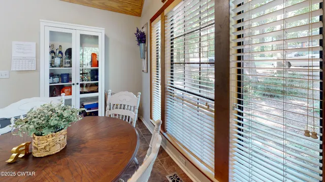 a view of a porch with furniture and a potted plant
