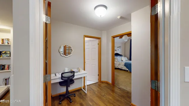 a bedroom with furniture and a window