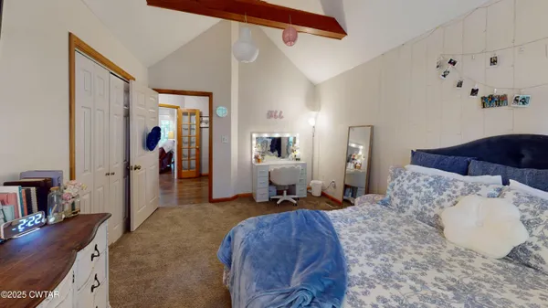 a bed room with a bed and a couch
