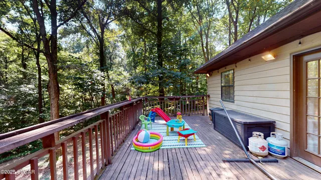 a wooden bench sitting in front of a building
