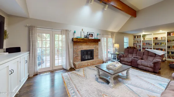 a living room with furniture and a fireplace