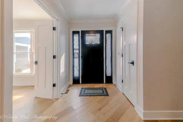 a view of a room with rack on the wall and a window