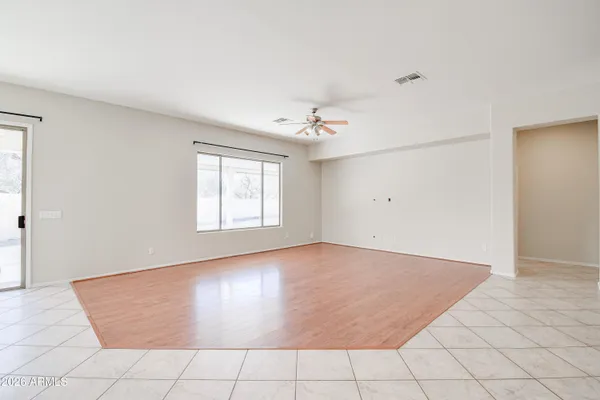 an empty room with windows and entrance