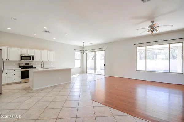 a view of a kitchen with a sink hardwood floor and a kitchen view