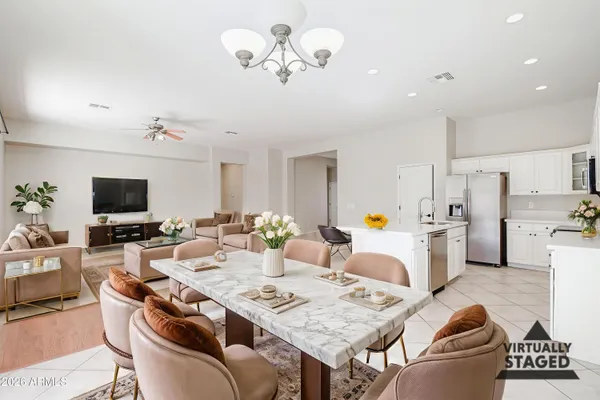 a large kitchen with cabinets and wooden floor