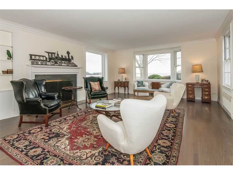 5 Bridle Path Lane Riverside, CT 06878 - Photo 4 of 11 a living room with furniture a fireplace and a large window