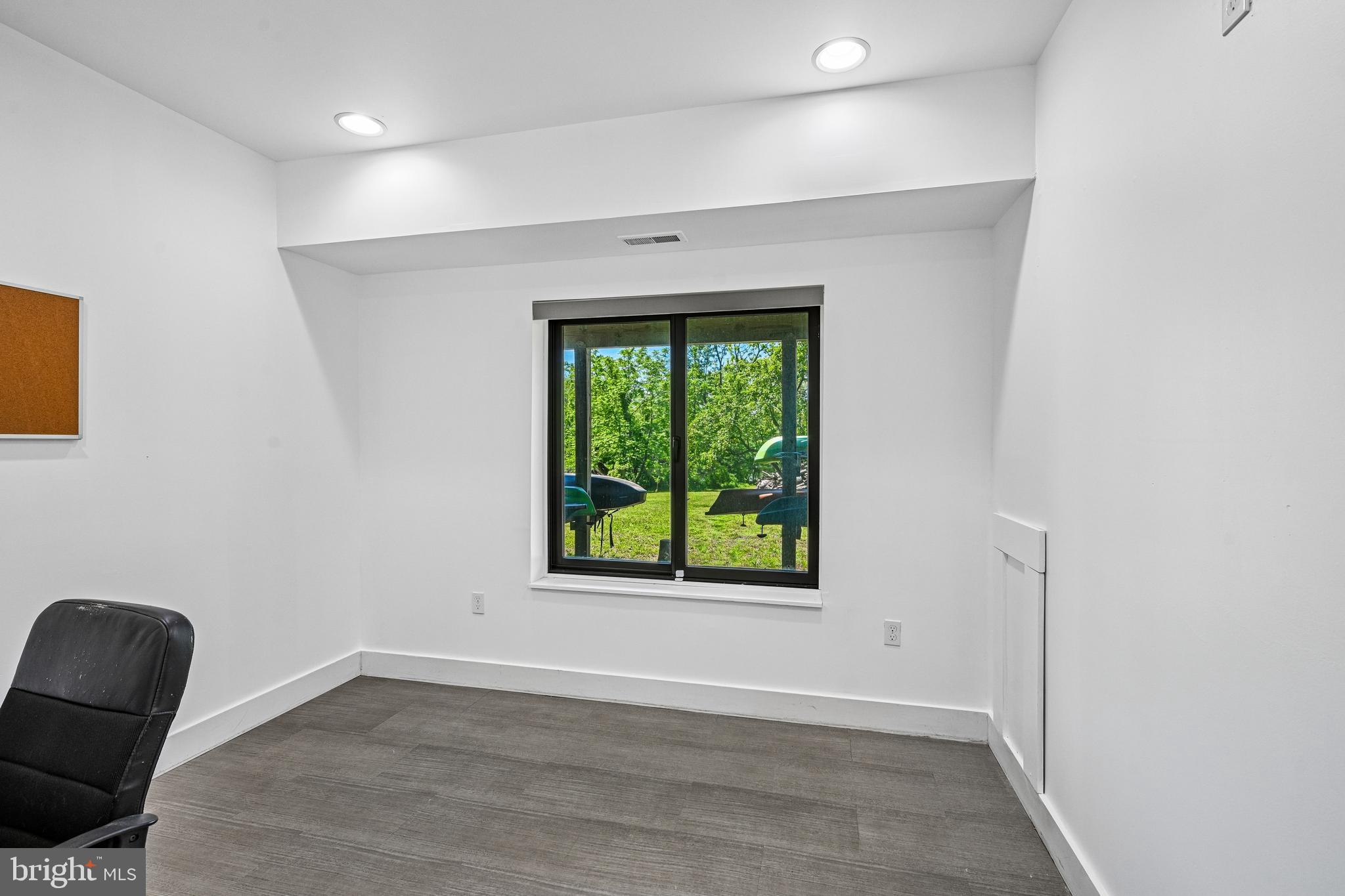 11 Forklanding Road Cinnaminson, NJ 08077 - Photo 42 of 77 an empty room with wooden floor and windows