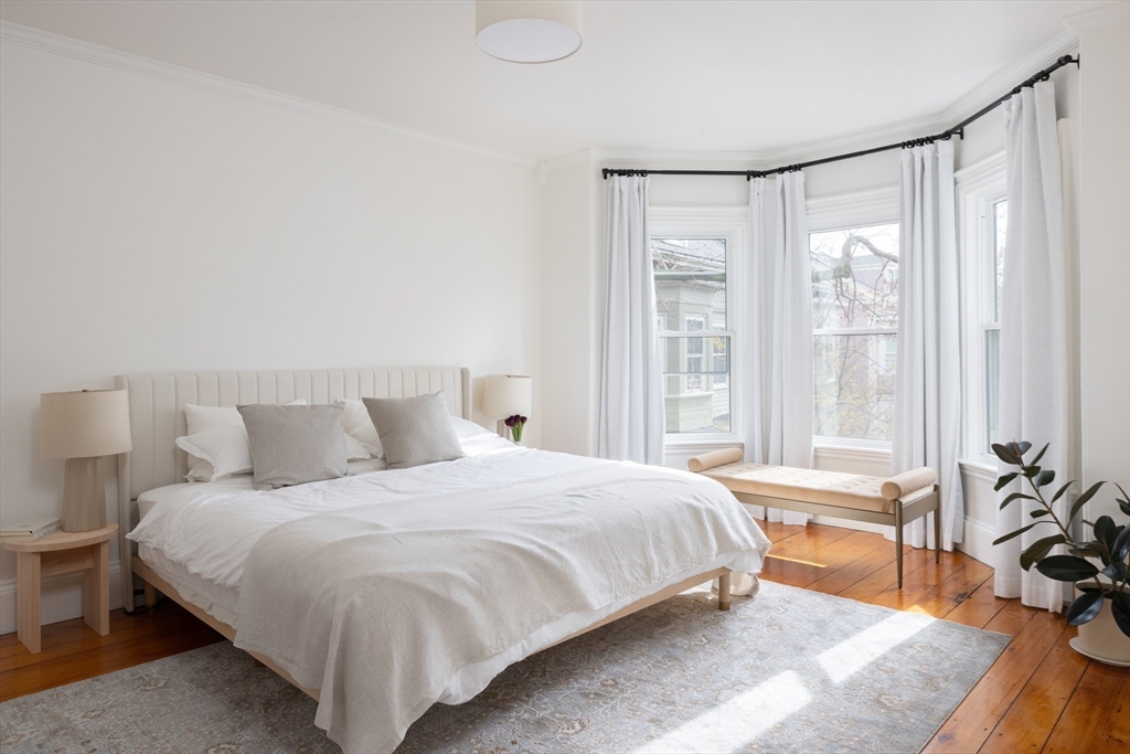 6 Warren Square, Unit 2 Boston, MA 02130 - Photo 10 of 18 a bedroom with a large bed and a large window