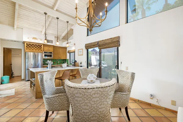 a view of a dining room with furniture window and outside view