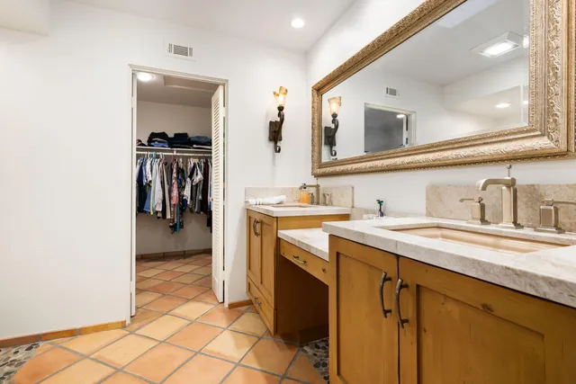 a kitchen with a sink and a refrigerator